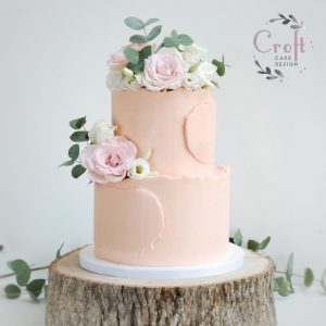 Buttercream wedding cake 2 tier with roses and eucalyptus
