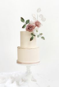 Elegant buttercream wedding cake with wafer paper flowers