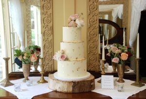 Ivory and gold wedding cake rustic buttercream