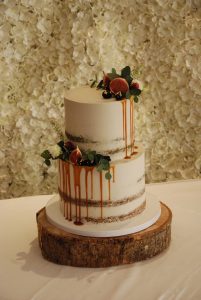 Rustic semi naked wedding cake with fruits