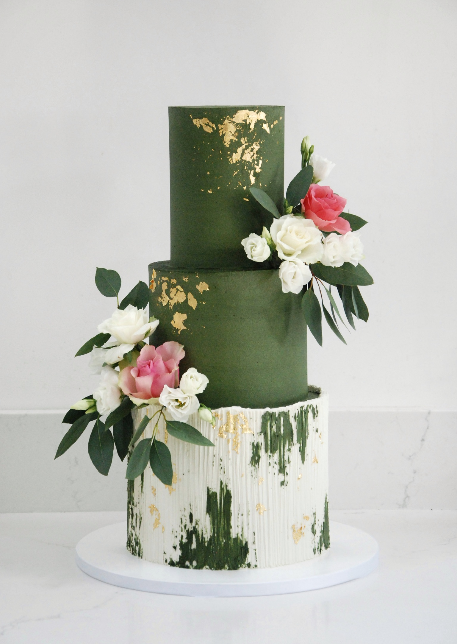 Modern trendy wedding cake green and gold