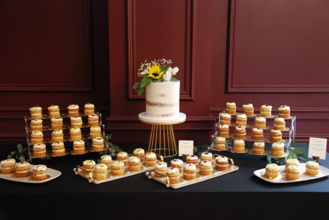 Vegan wedding cake table and mini cakes